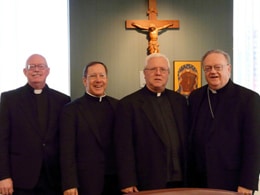 Monsignor Douglas Mathers, second from left, vice chancellor of the archdiocese and episcopal delegate for the cause, joins Auxiliary Bishop Dennis Sullivan, the archdiocese’s vicar general, right; Father Edward M. Dougherty, M.M, superior general of the Maryknoll Fathers and Brothers, second from right; and Father Michael P. Walsh, M.M., member of the historical commission, left, at the swearing-in ceremony for the opening of the sainthood cause of Maryknoll co-founder Bishop James A. Walsh at the Catholic Center in Manhattan on November 9.