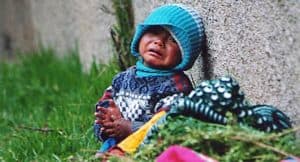 Baby crying on the side of the road (Peru)