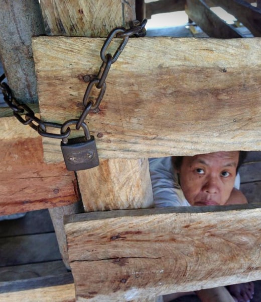 A woman caged and bound (Cambodia) A woman caged and bound (Cambodia)