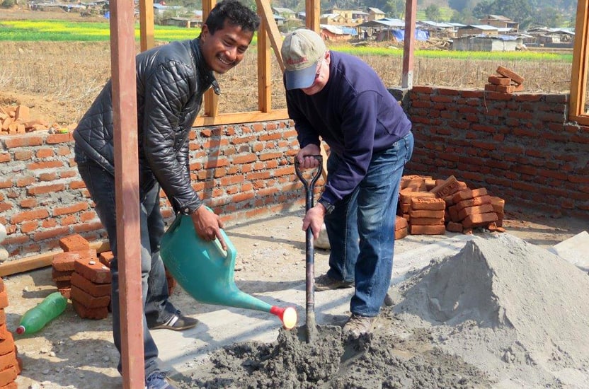 Mixing cement (Nepal)