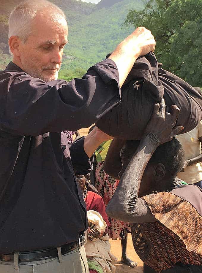 Fr. Barth feeding hungry in East Africa